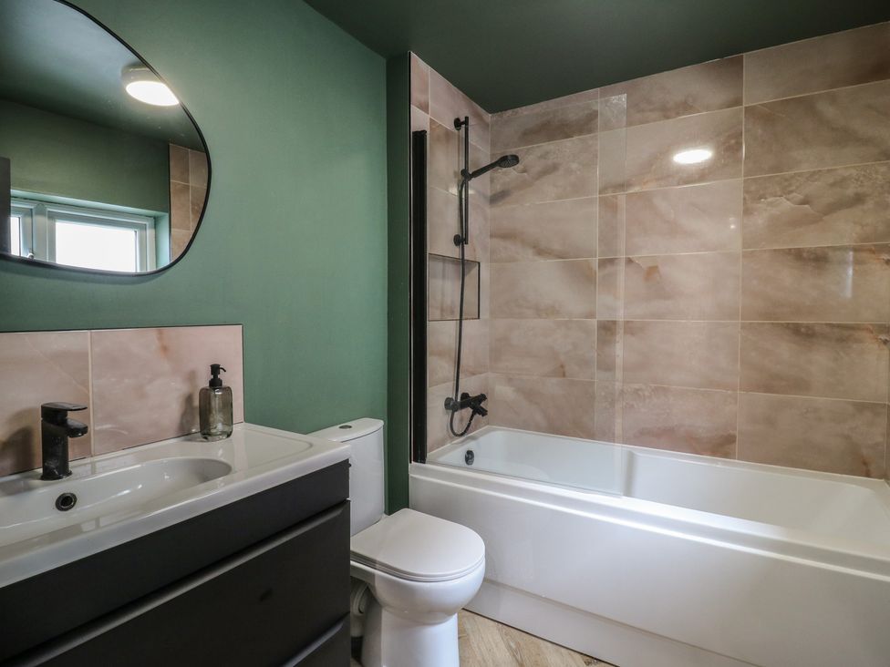 A bathroom with a sink, toilet, and bath at Seibiant in Ramsgate