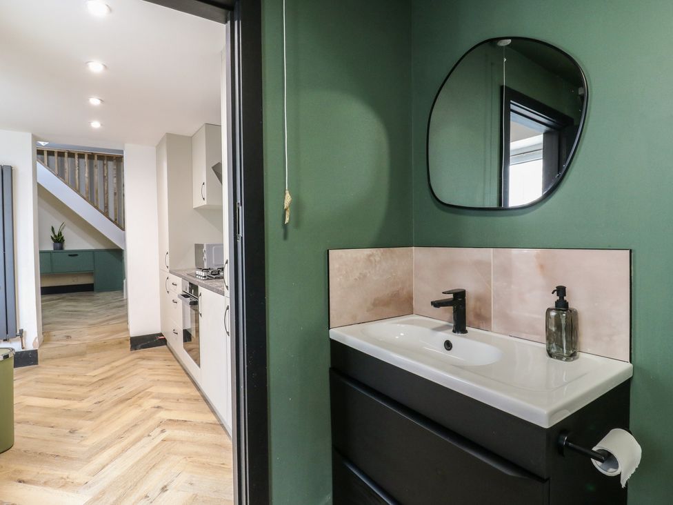 A bathroom with a sink and mirror at Seibiant in Ramsgate