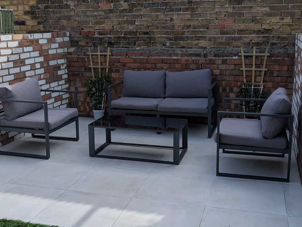 An outdoor seating area with a sofa and armchairs at Seibiant in Ramsgate