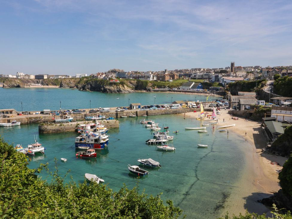 A view of the harbor with boats and beach at Higher Tower Road