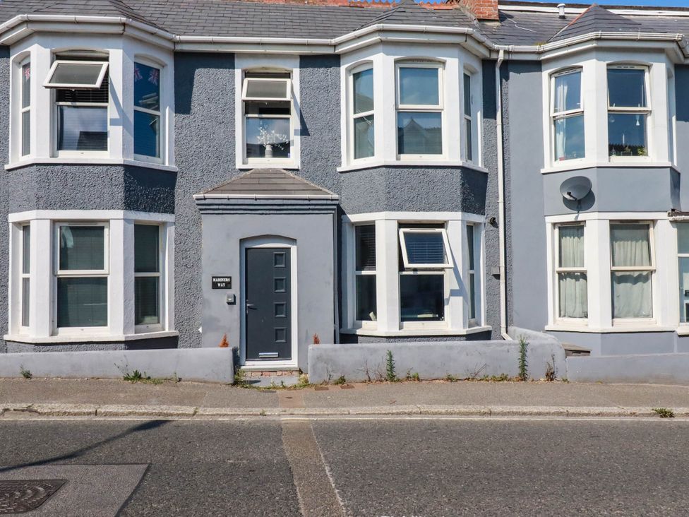 A house with multiple windows and a front door at Higher Tower Road 