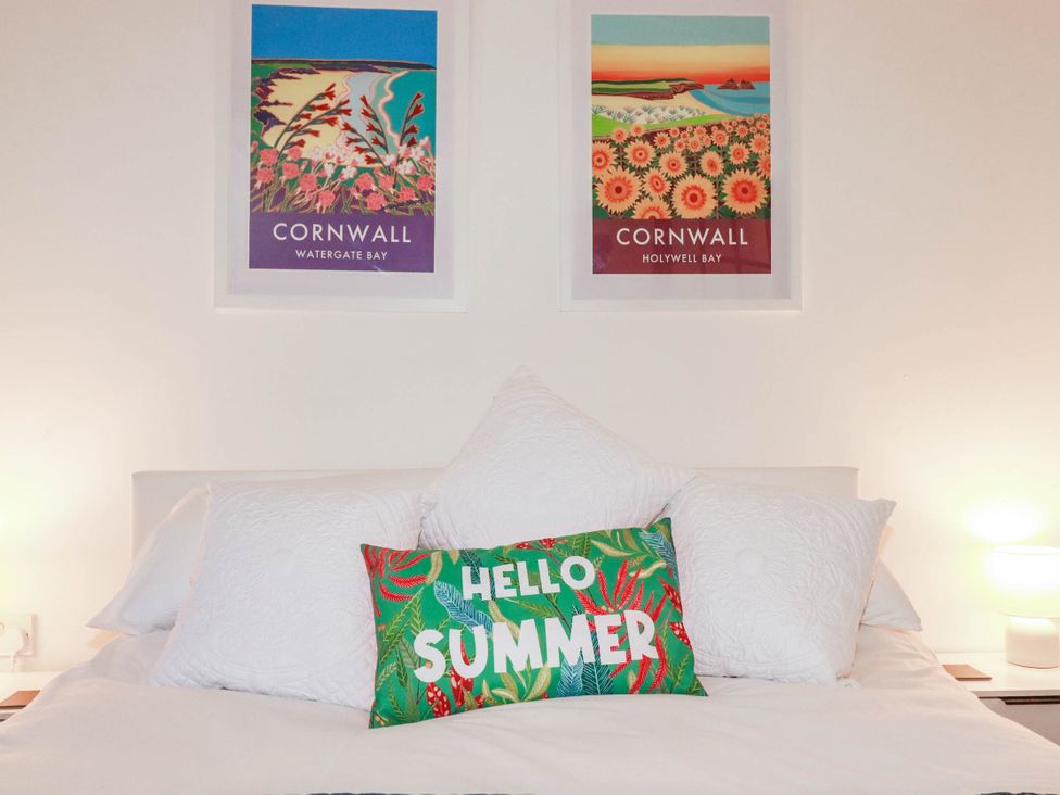 A bedroom with a bed and wall art at Higher Tower Road