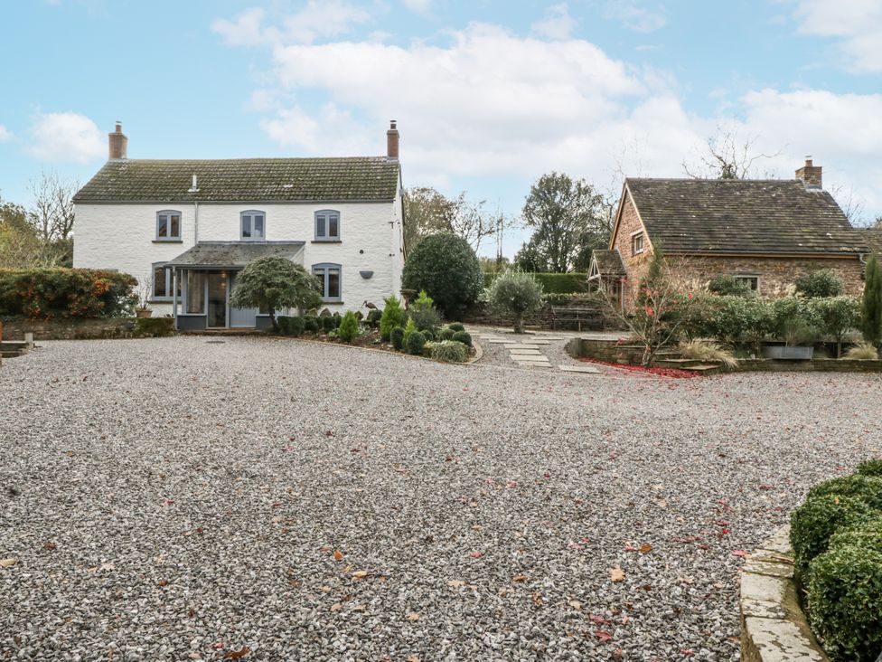 A house with a gravel driveway and garden at 1 bed property in Usk