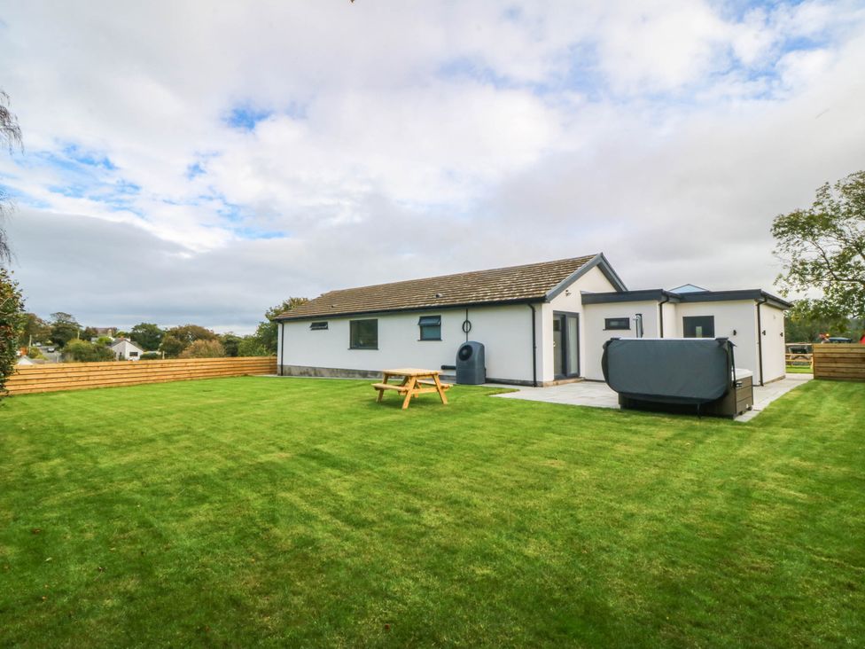 A house with a garden and seating area at Angorfa in Pentraeth