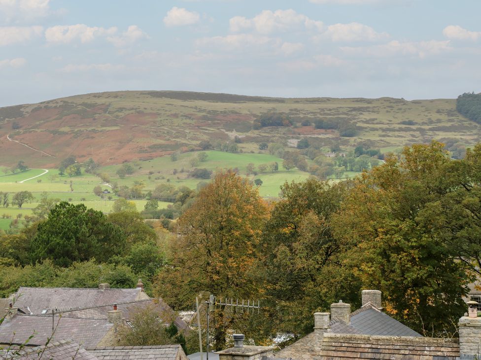 A view of hills and trees with houses in the foreground at Bradshaw House in Hope Valley