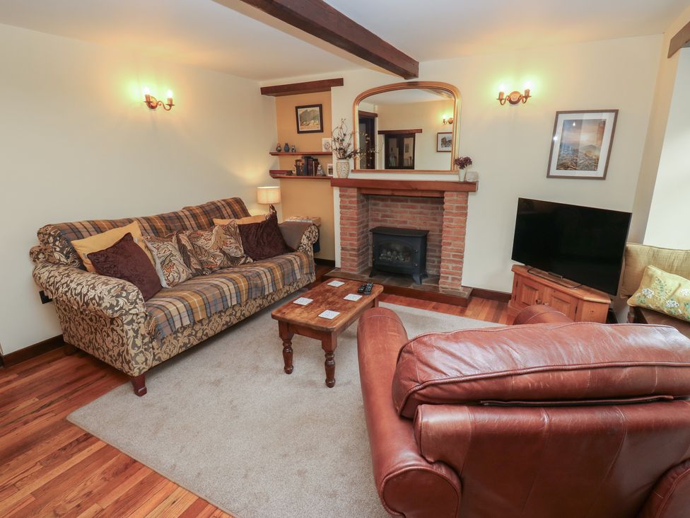 A living room with a sofa and coffee table at Bradshaw House in Hope Valley