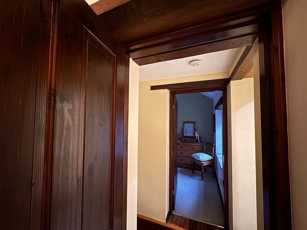 A hallway with a mirror and chest of drawers at Bradshaw House, Castleton, Peak District