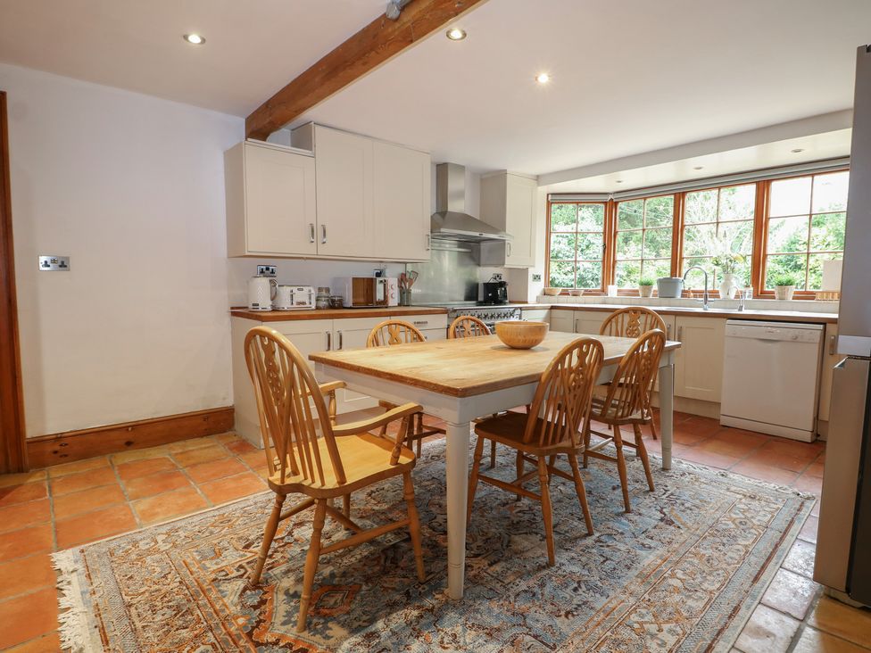 A kitchen with a dining table and chairs at Old Vicarage