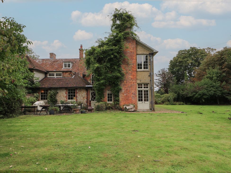 An outdoor view of a house with a garden at Old Vicarage 