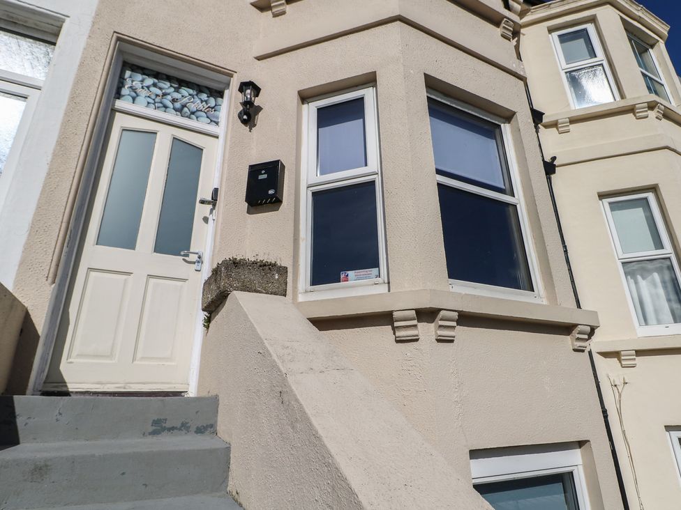 A front entrance with door and windows at Pebbles Eastbourne