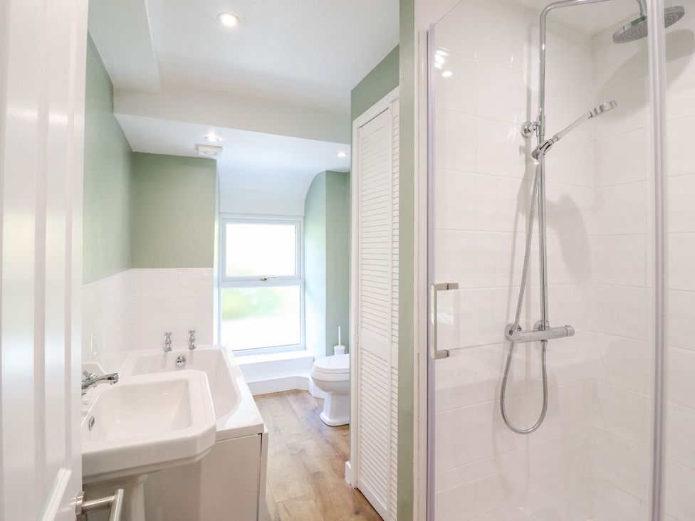 A bathroom with a shower and toilet at Haulfryn in Dolwyddelan