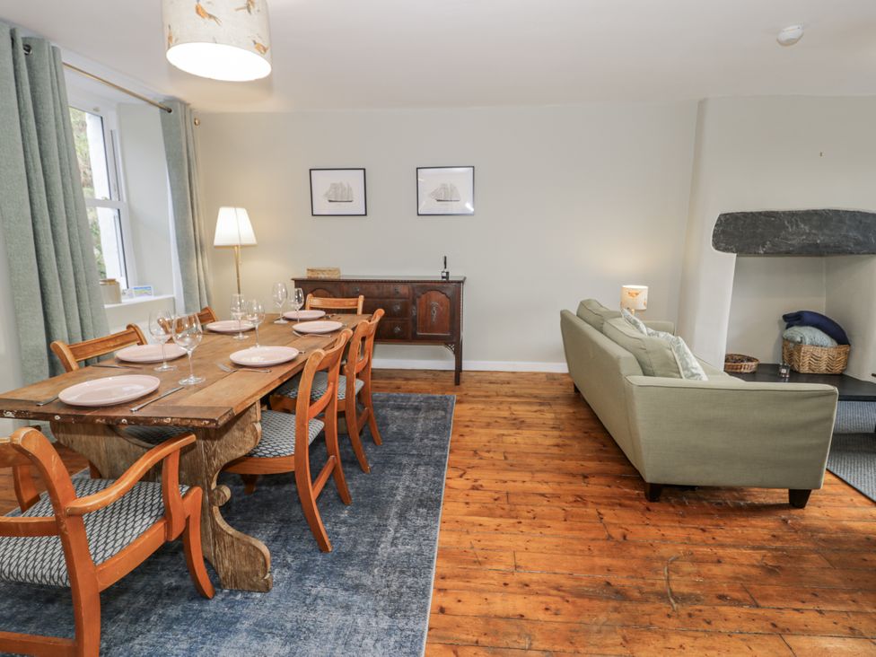 A dining room with a table and chairs at Haulfryn in Dolwyddelan