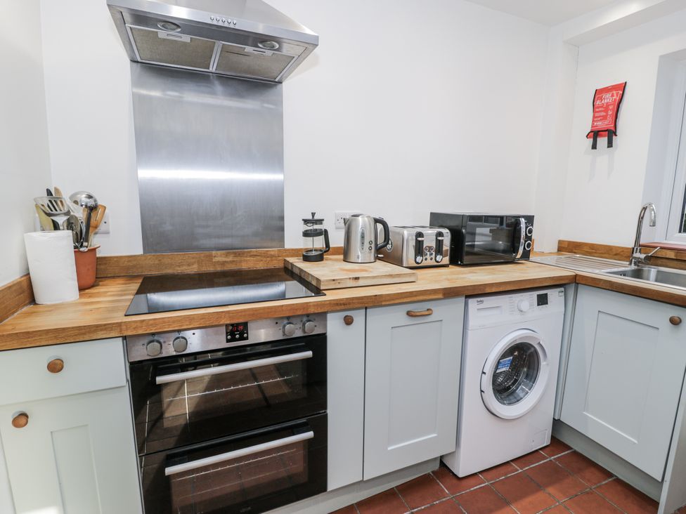 A kitchen with appliances and countertop at Haulfryn in Dolwyddelan