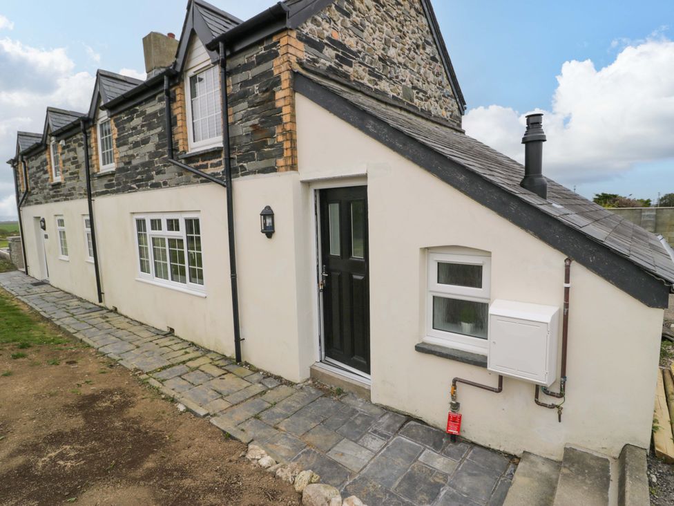 A house exterior with a door and window at Rosemary Cottage 1 Tywyn