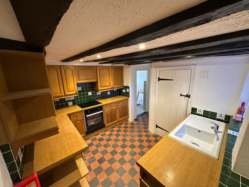 A kitchen with cabinets and an oven at Hop Cottage in Petersfield