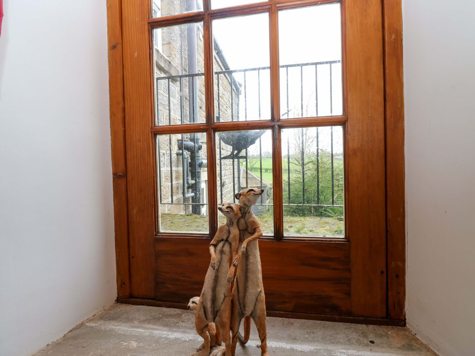 A window with a sculpture at The Hay Barn in 
