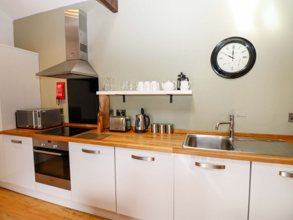 A kitchen with appliances and utensils at The Warren Barn in Kirkby Malzeard