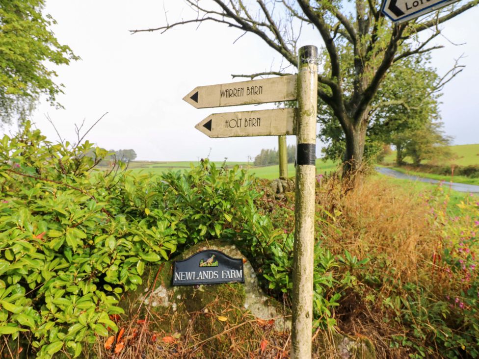 A signpost for Holt Barn and Warren Barn at Newlands Farm in Kirkby Malzeard