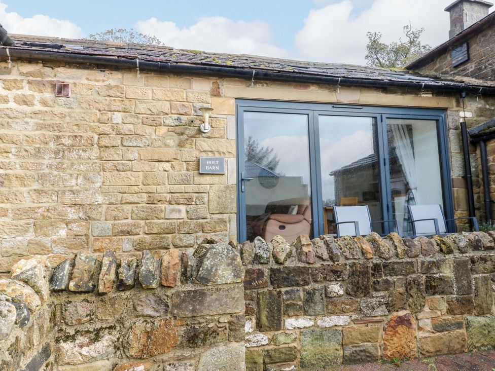 Exterior view of Holt Barn with stone wall and window at The Holt Barn in Kirkby Malzeard