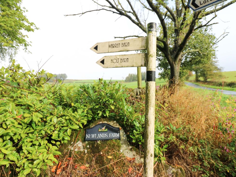 A signpost indicating direction to Holt Barn and Warren Barn at Newlands Farm Kirkby Malzeard