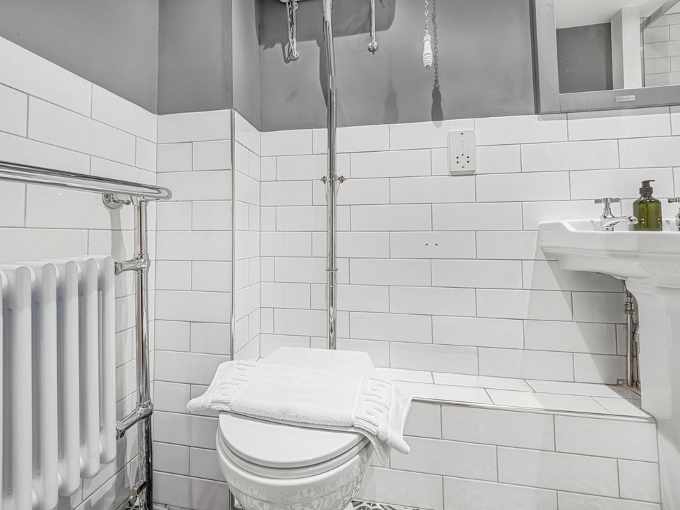 A bathroom with a toilet and sink at Central Vista Retreat Chester