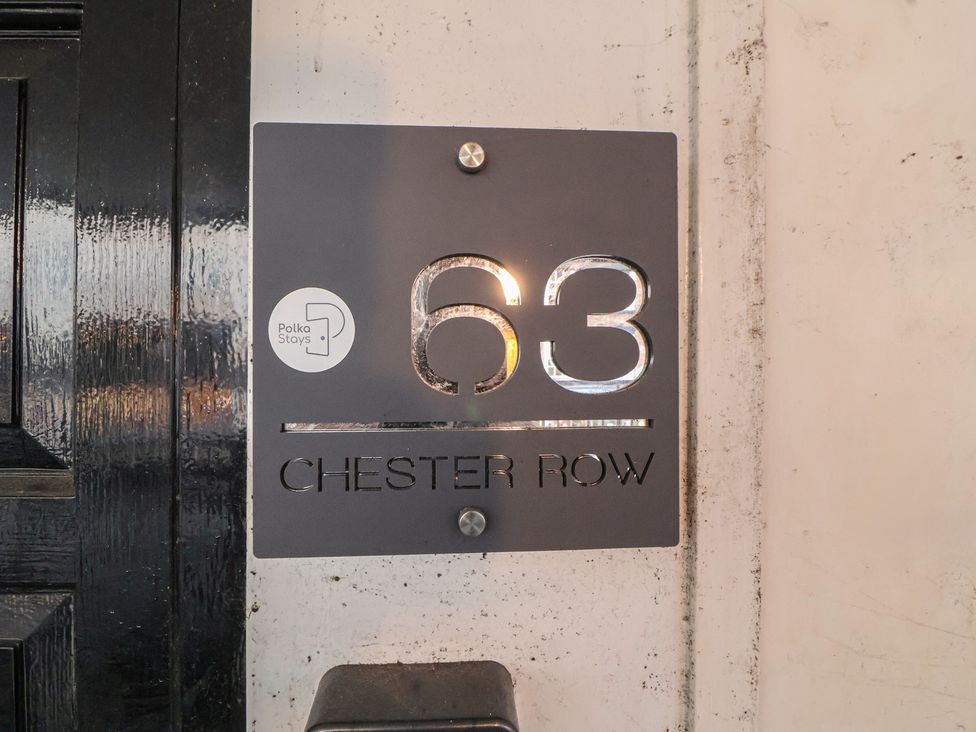 A house number sign displaying 63 Chester Row at Central Vista Retreat Chester