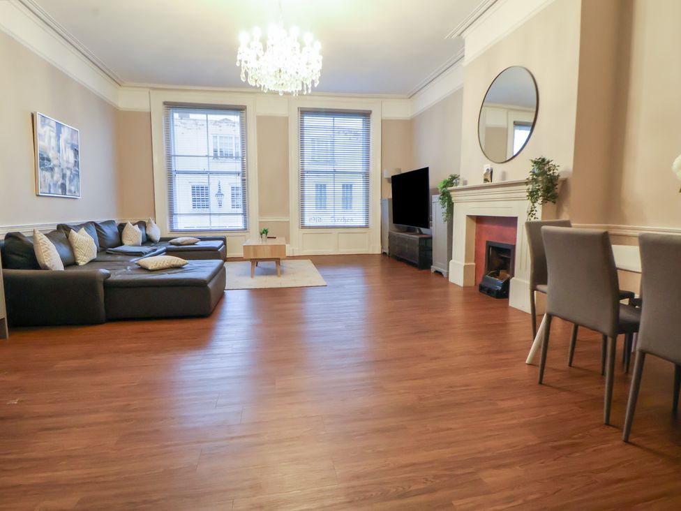 A living room with a sofa and coffee table at Central Vista Retreat in Chester