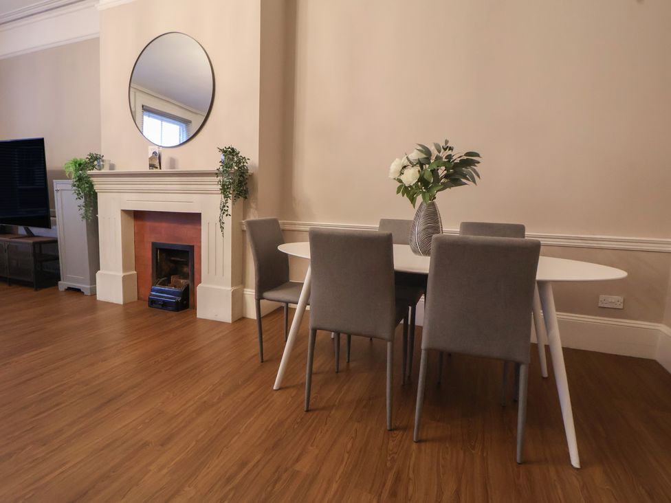 A dining room with a table and chairs at Central Vista Retreat in Chester