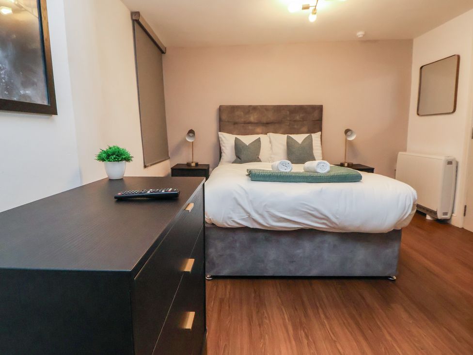 A bedroom with a bed and dresser at Central Vista Retreat in Chester
