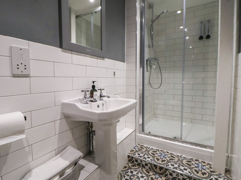 A bathroom featuring a sink and shower at Central Vista Retreat in Chester