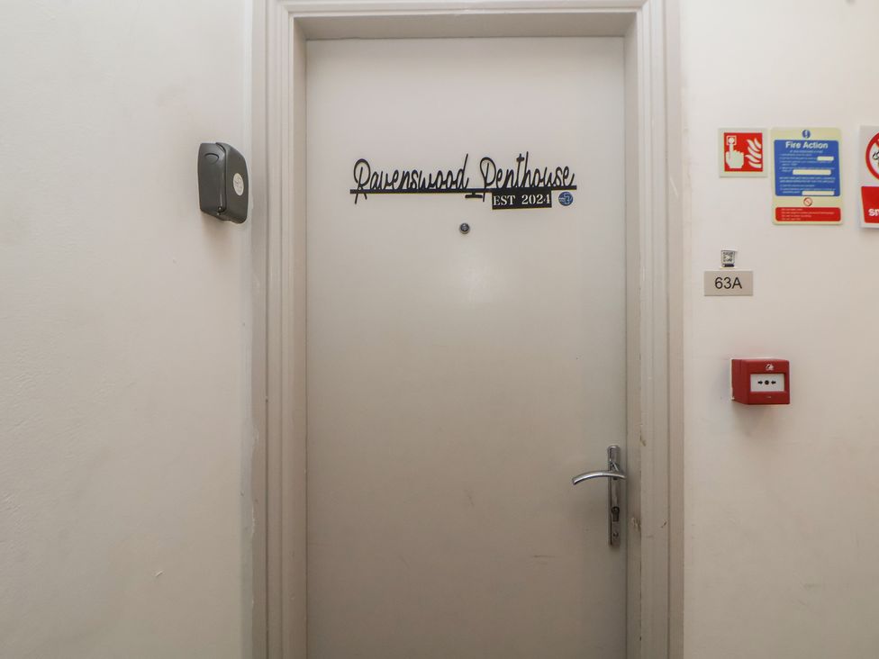 An entrance door with signage at Ravenswood Penthouse Chester