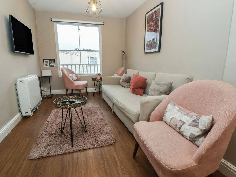 A living room with a sofa and armchairs at Ravenswood Penthouse in Chester
