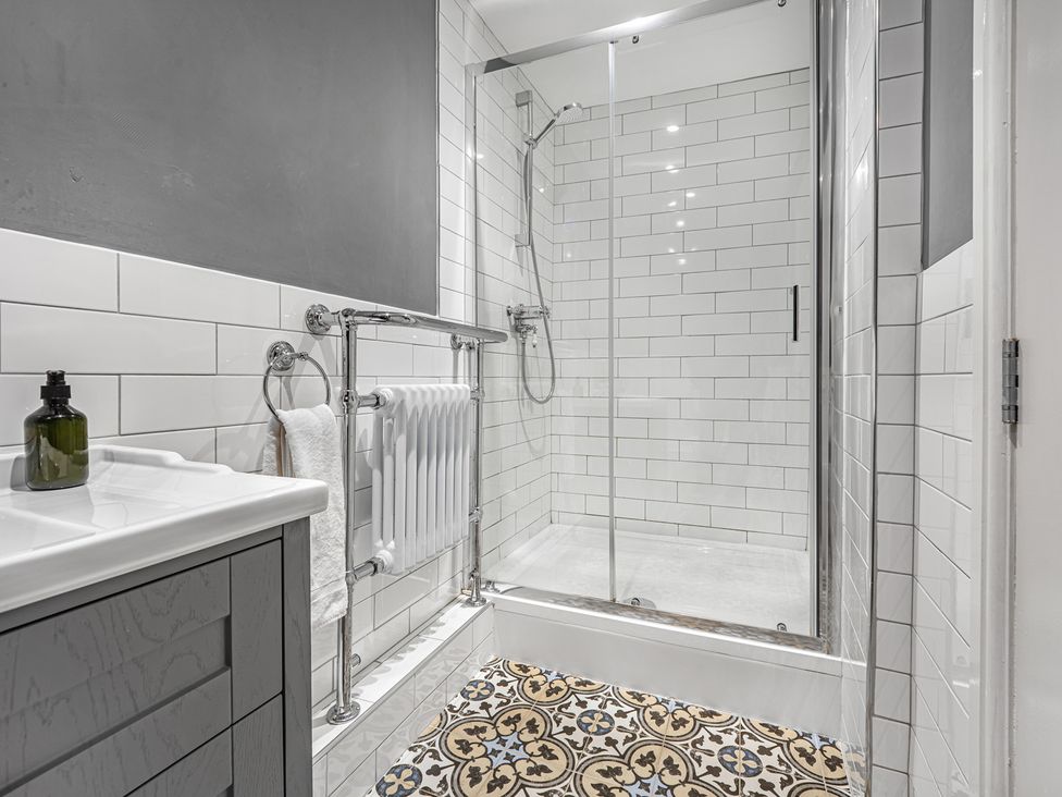 A bathroom with a shower and sink at Kingsley Loft Chester