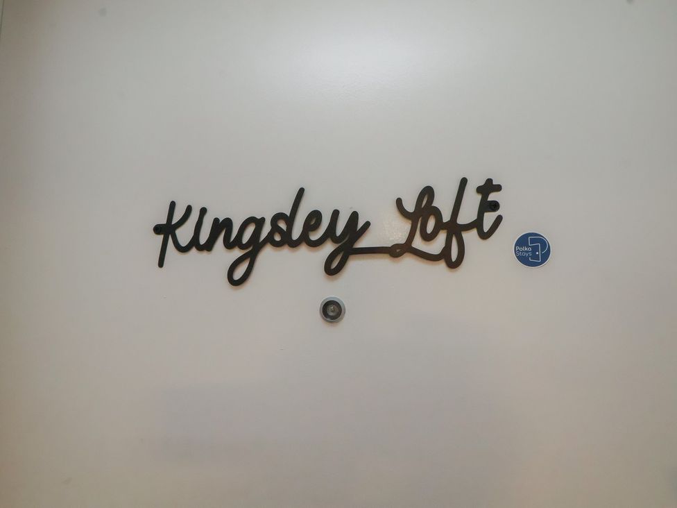 A door with a nameplate and a sticker at Kingsley Loft Chester