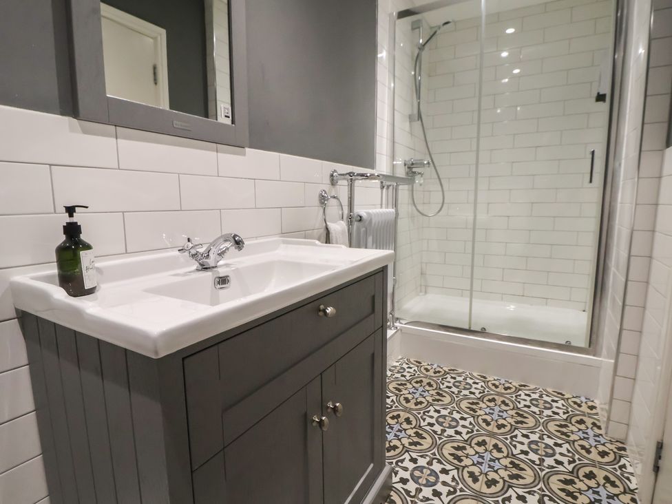 A bathroom with a sink and shower at Kingsley Loft in Chester