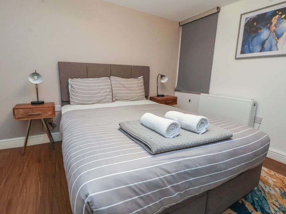 A bedroom with a bed and bedside table at Kingsley Loft in Chester