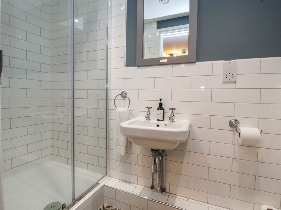 A bathroom with a shower and sink at Kingsley Loft, Chester