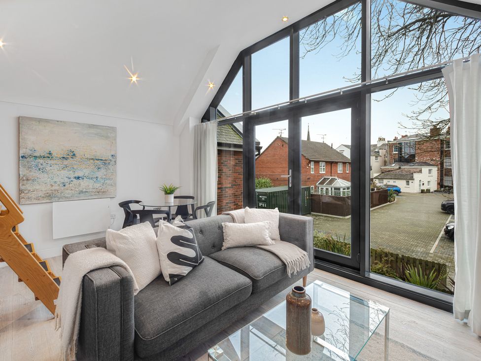 A living room with a sofa and table at Southview Apartment Chester