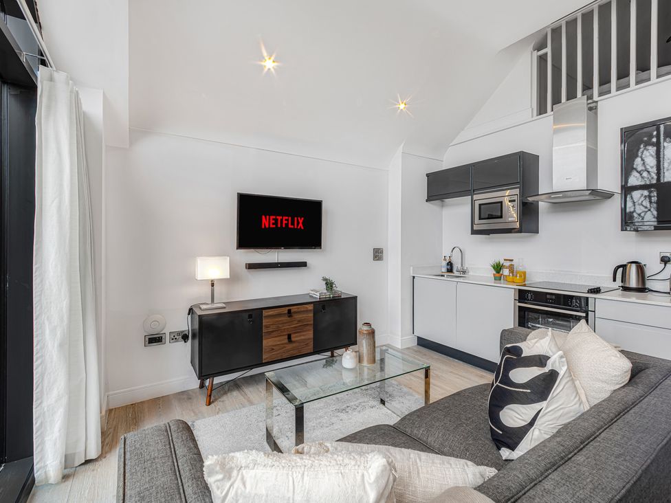 A living room with a sofa and television at Southview Apartment in Chester