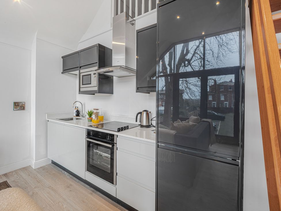 A kitchen with appliances including a fridge and oven at Southview Apartment Chester