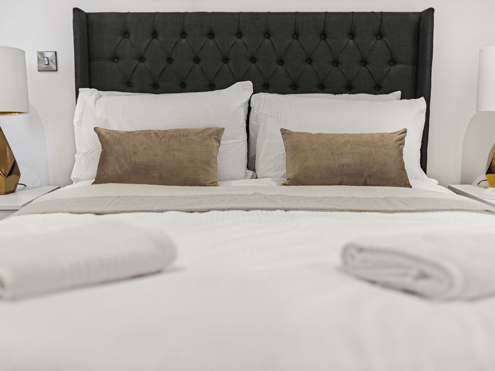 A bedroom with a bed and pillows at Southview Apartment in Chester