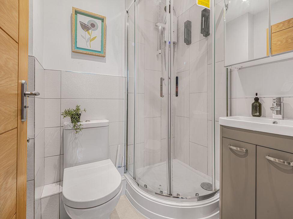 A bathroom featuring a shower, toilet, and sink at Southview Apartment in Chester