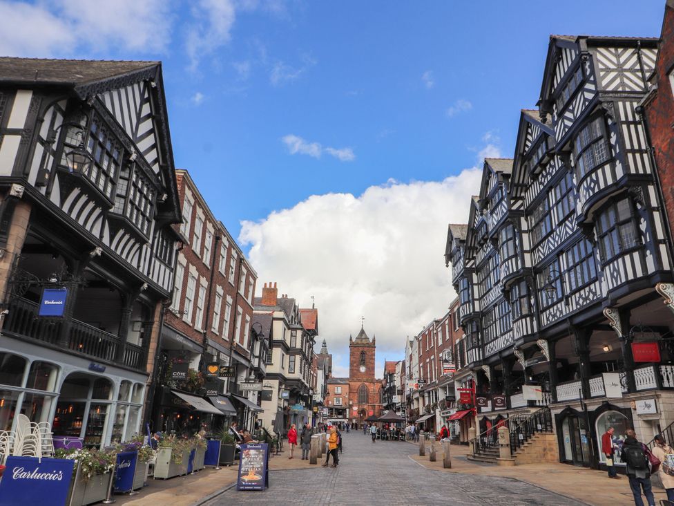 A street view with shops and buildings at Southview Apartment in Chester