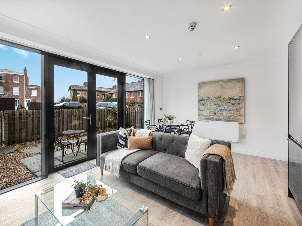 A living room with a sofa and a coffee table at Eastgate Suite in Chester