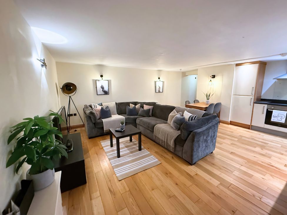 A living room with a sofa and coffee table at The Stables in Troutbeck