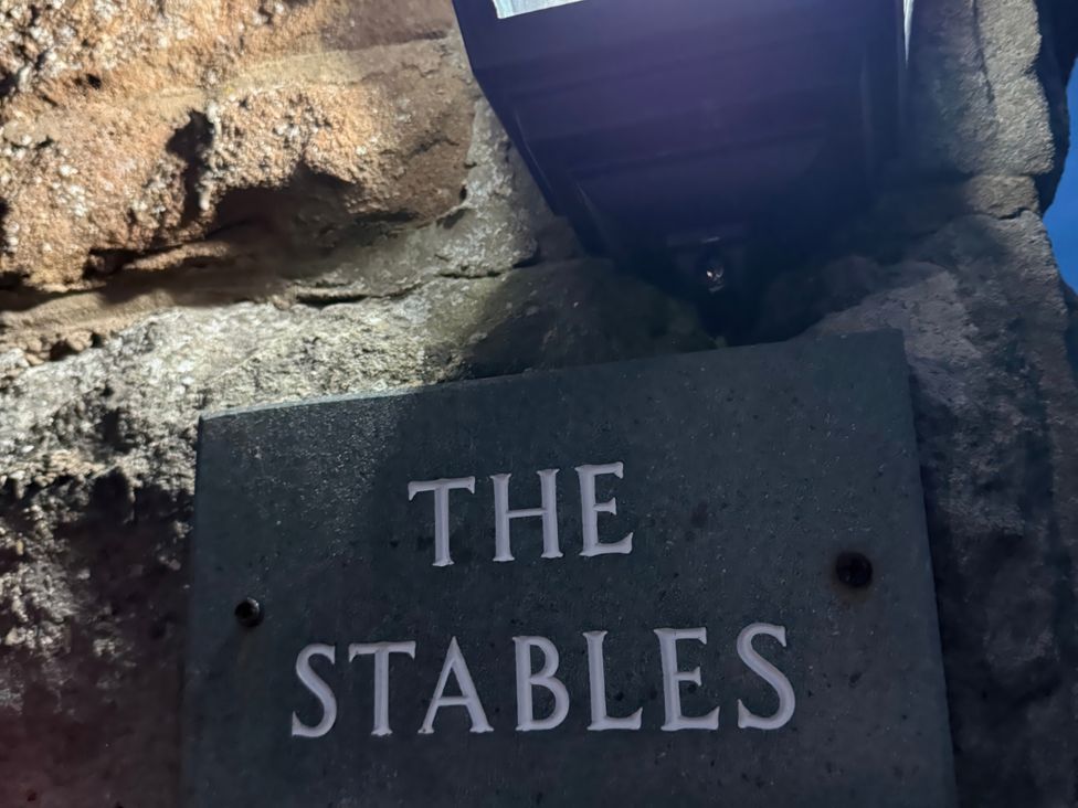 A sign displaying The Stables at The Stables in Troutbeck