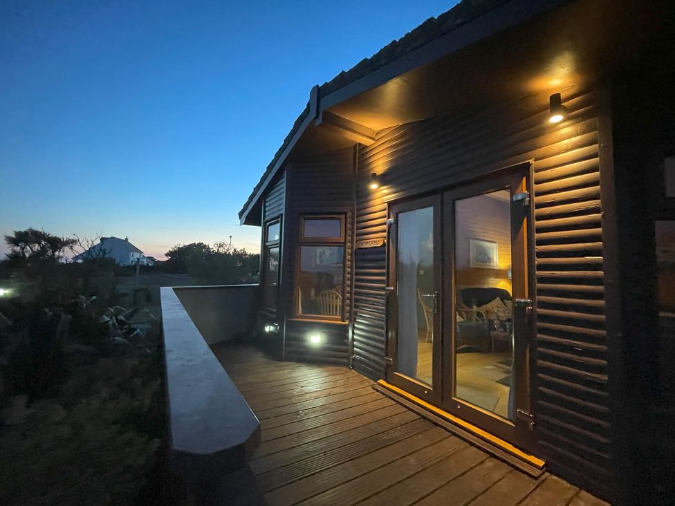 An exterior view of a house with a deck at Lamorna Sennen