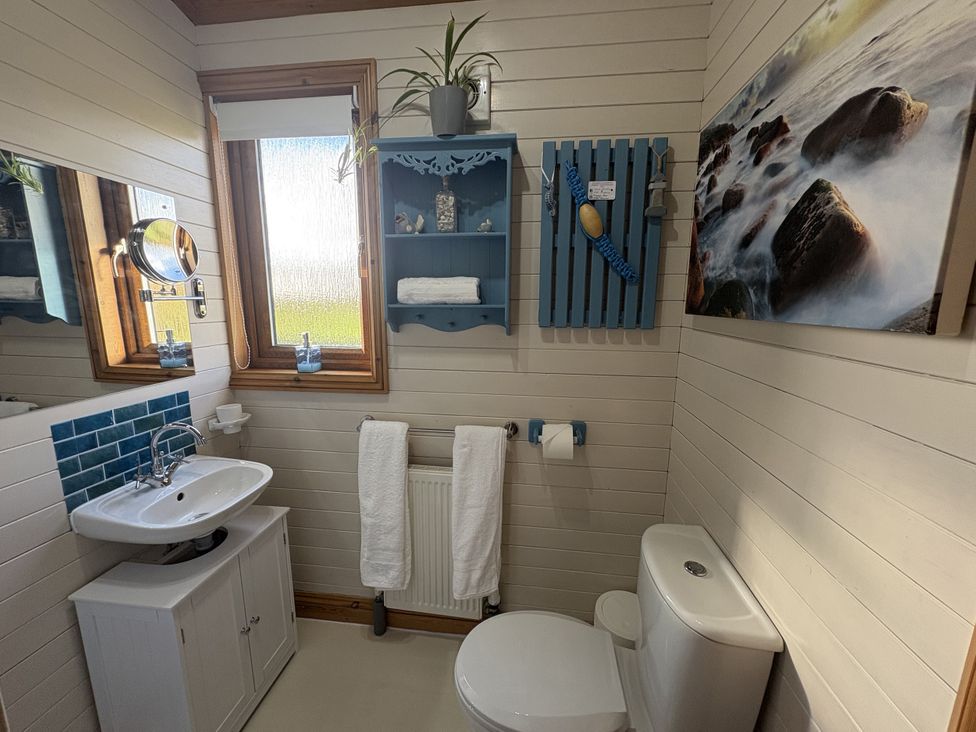 A bathroom with sink and toilet at Lamorna in Sennen