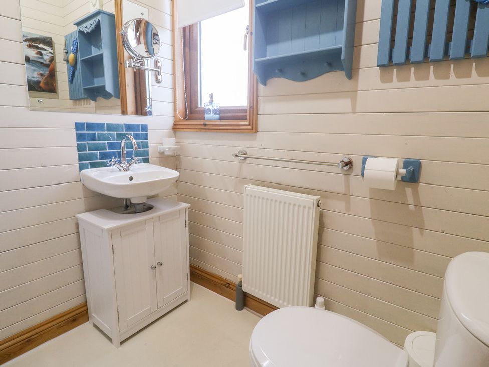 A bathroom with a sink and toilet at Lamorna in Sennen