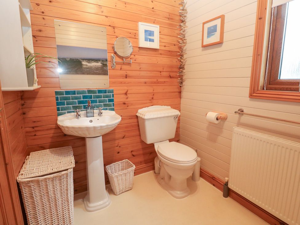 A bathroom with a sink and toilet at Lamorna in Sennen